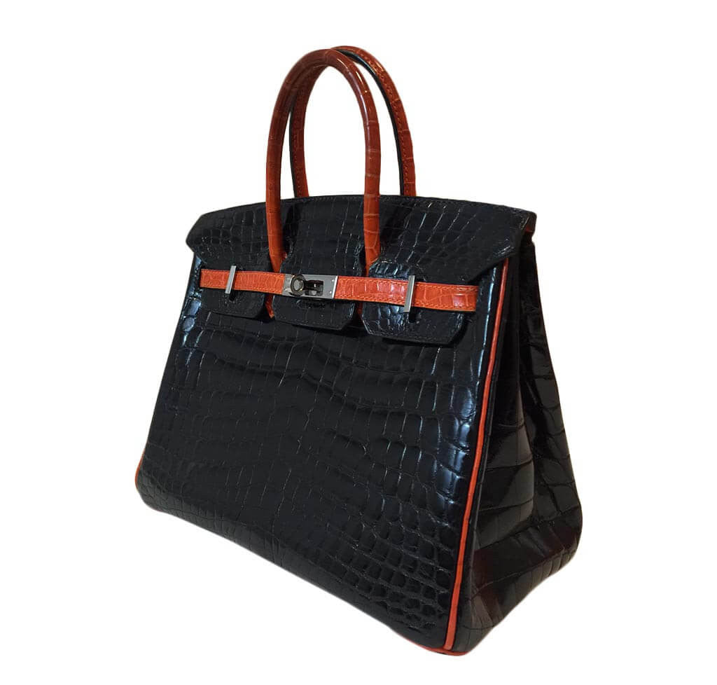 Victoria Beckham, carrying a rare dark red crocodile Hermes